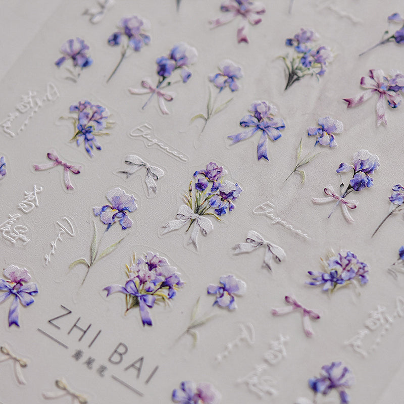 Nail stickers with vibrant blue flowers and bowknots