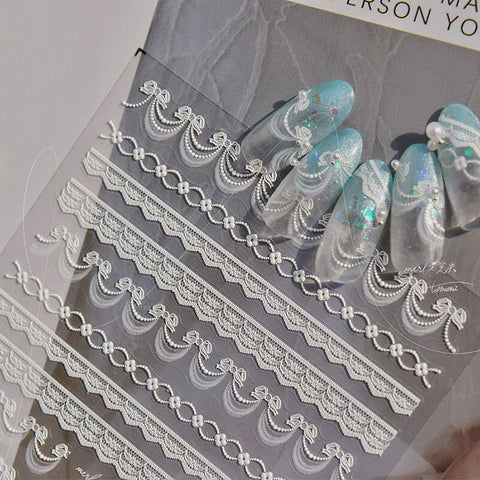 Nails beautifully decorated with Dainty Lace Strip Nail Stickers, featuring elegant bowknot lace strip design