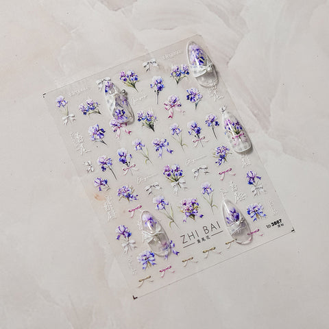 Floral nail stickers featuring blue roses and green leaves