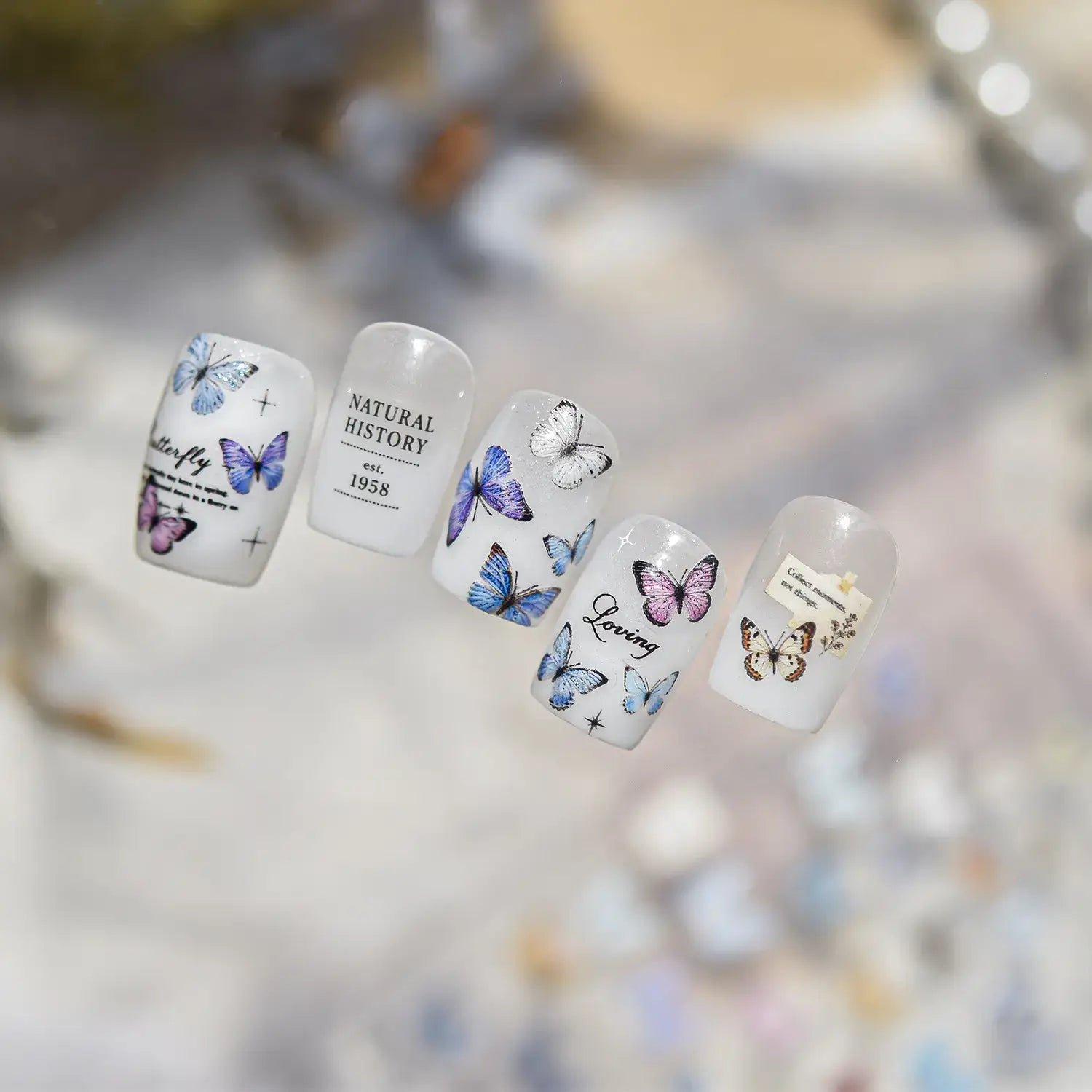 Blue_butterfly_nail_art_on_pressed-on_nails