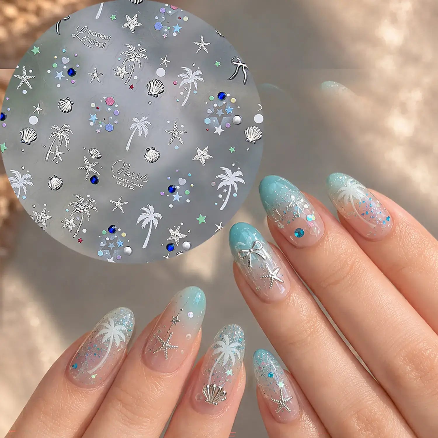 Beach theme nail art on light blue nails

