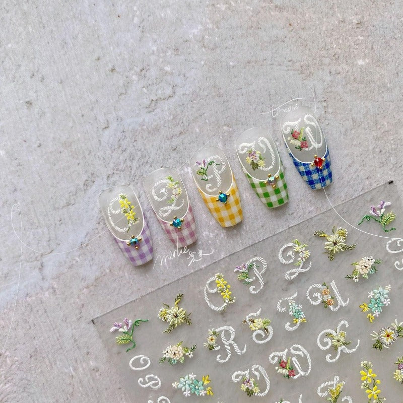 flower and letter nail design