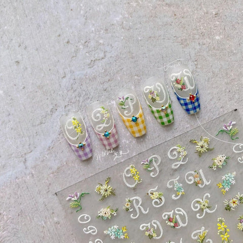 flower and letter nail design